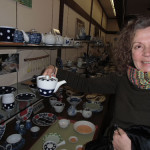 Woman Holding Pottery